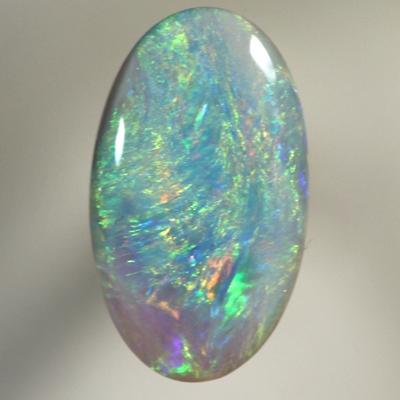 SOLID SEMI BLACK OPAL Bright sparkling colours moving over turquoise blue 